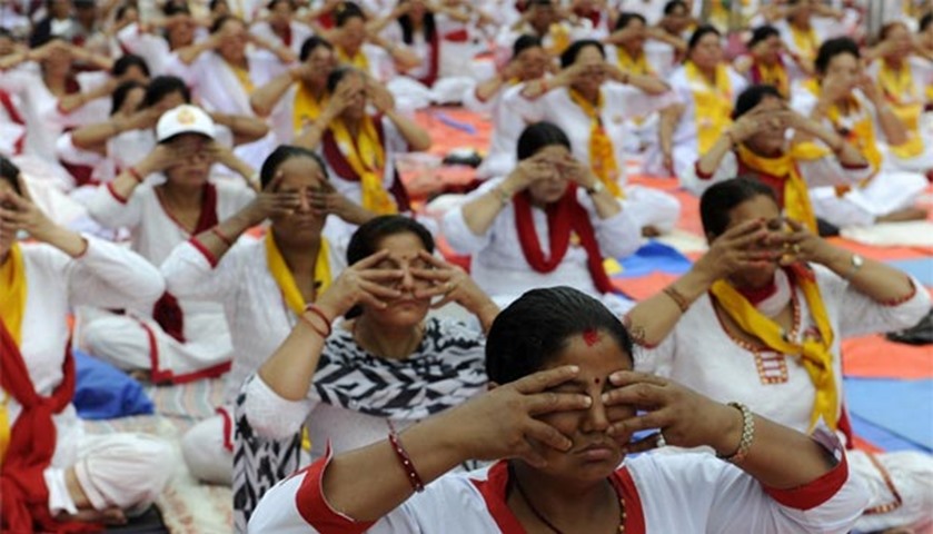 Yoga is seen as a means of enlightenment. Pictured are practitioners in Kathmandu
