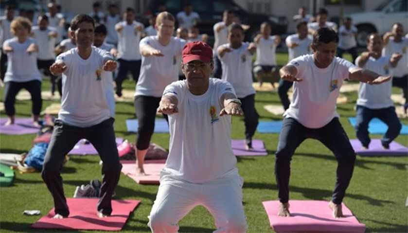 Afghans and foreigners take part in a yoga session at the Indian embassy in Kabul on Tuesday