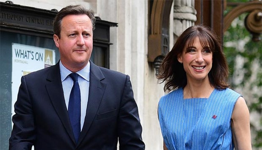 Prime Minister David Cameron and his wife Samantha arrive at a polling station in central London