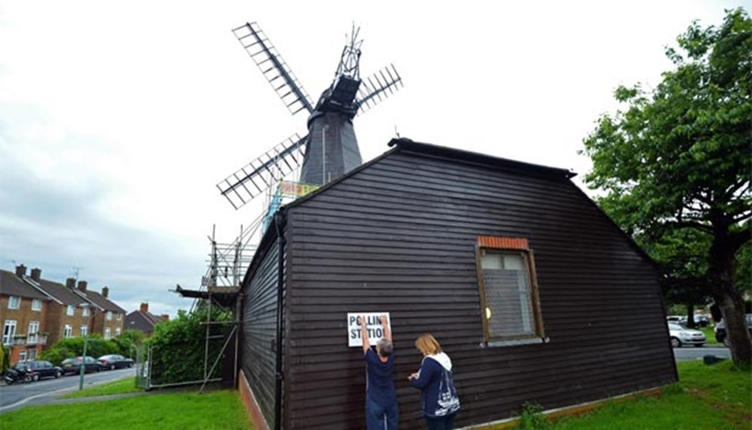Signs are put up outside a polling station at West Blatchington Windmill near Brighton