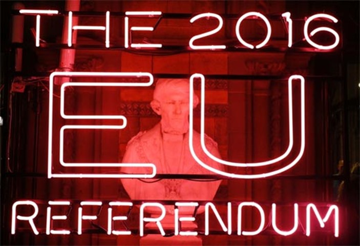 A neon sign for the 2016 referendum is attached to the doors of the announcement hall in Manchester