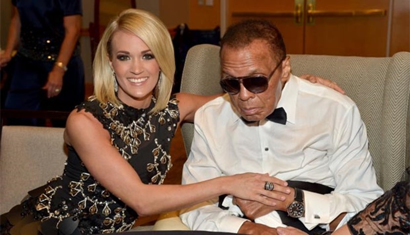 Muhammad Ali, seen with Carrie Underwood, attends a Celebrity Fight Night in Phoenix in April 2016