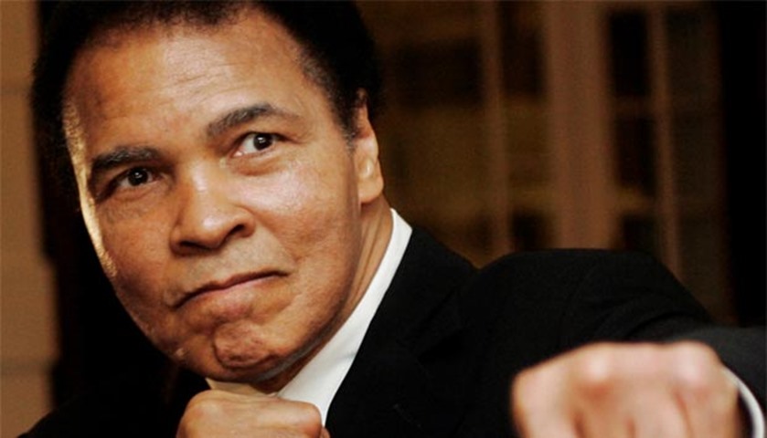 Muhammad Ali poses during an award ceremony at the World Economic Forum in Davos in 2006
