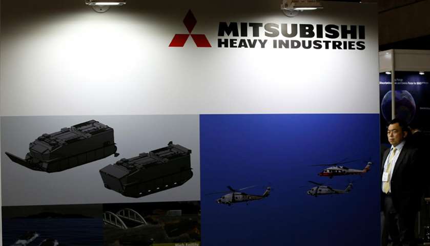 A visitor is seen at Mitsubishi Heavy Industries\' booth during the MAST show in Chiba, Japan