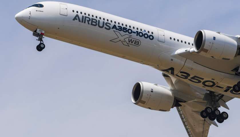 An Airbus A350-1000 XWB jet airliner performs its show flight during the International Paris Air Sho