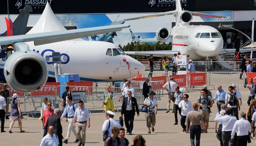 Visitors walk past the aircrafts on the static display during the 52nd Paris Air Show at Le Bourget 