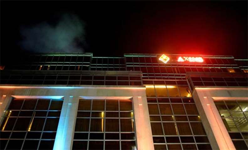 Smoke comes out of the roof of the Resorts World Hotel in Manila following an attack