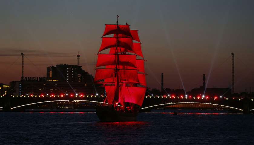 Sweden\'s brig Tre Kronor with scarlet sails floats on the Neva River during the Scarlet Sails festiv