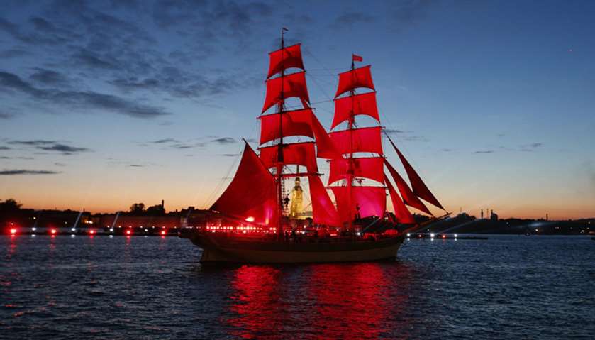 Sweden\'s brig Tre Kronor with scarlet sails floats on the Neva River during the Scarlet Sails festiv