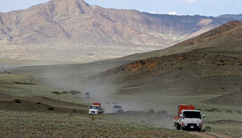 Trucks carrying Dzungarian horses drive to Takhin Tal National Park, Mongolia
