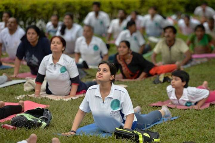 A yoga session in progress at Cubbon Park in Bengaluru on the eve of International Yoga Day