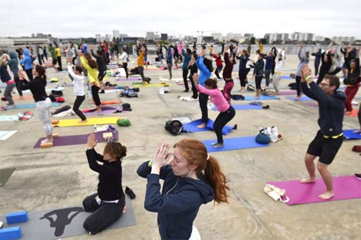 People take part in a yoga session organised by Nava Yoga Nantes association on Thursday