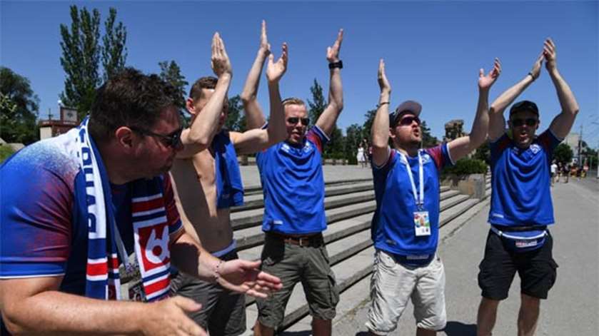 Supporters of Iceland\'s team clap while visiting a World War Two memorial complex in Volgograd