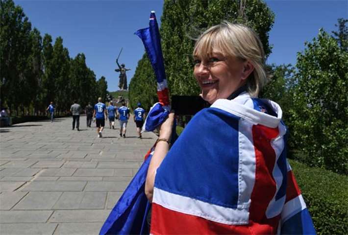 An Iceland supporter smiles while visiting a memorial in Volgograd on Friday