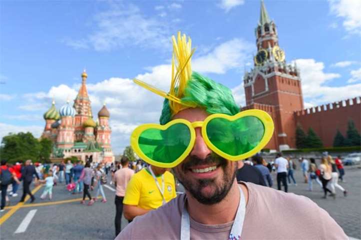 A Brazil fan poses at the Red Square in Moscow during the World Cup tournament