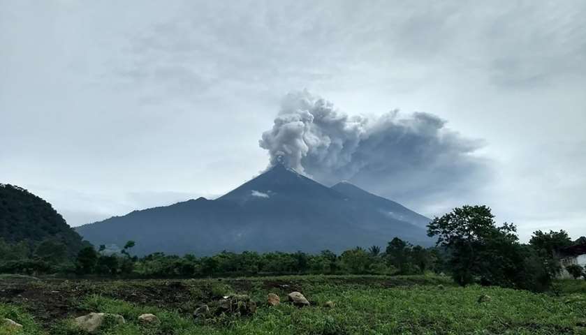 Volcano Fuego during an eruptive pulse in El Rodeo, Guatemala