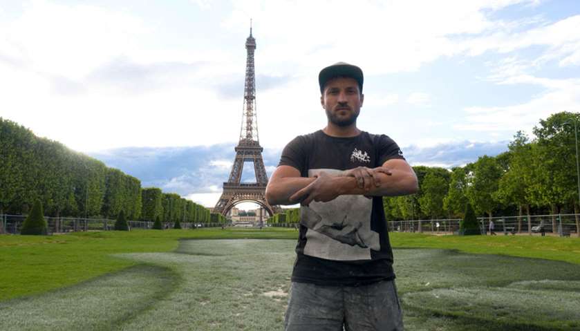 French land artist SAYPE  in front of Eiffel Tower