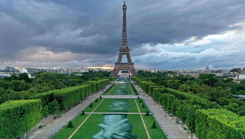 ‘Beyong Walls’ artwork set up at Paris\' landmark Champs de Mars gardens in front of the Eiffel Tower