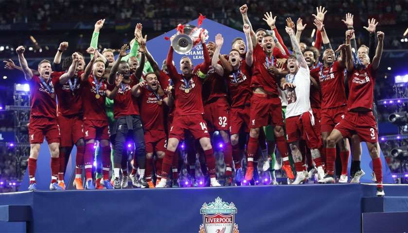 Liverpool celebrate with the trophy after winning the champions league