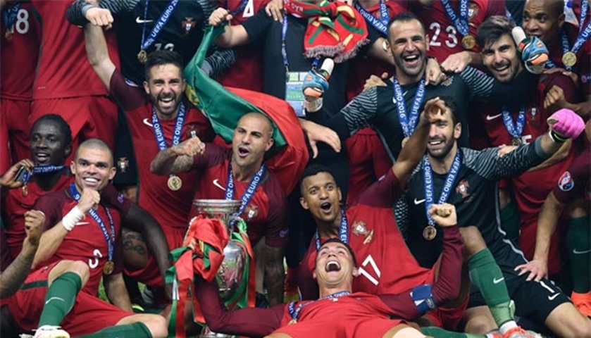 Portugal players celebrate after beating France 1-0 in the Euro 2016 final in Paris