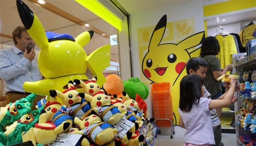 Customers visit a shop selling Pokemon goods in Tokyo, as Pokemon-mania sweeps the planet