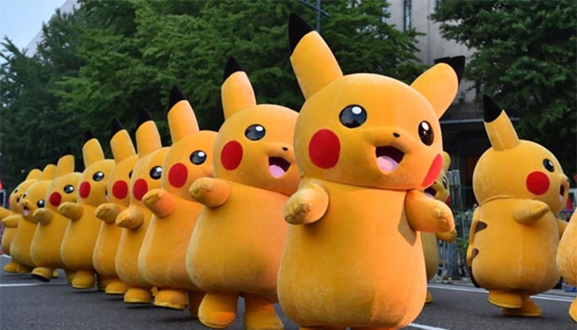 Costumed performers dressed as Pikachu, a Pokemon series character, attend an event in Japan