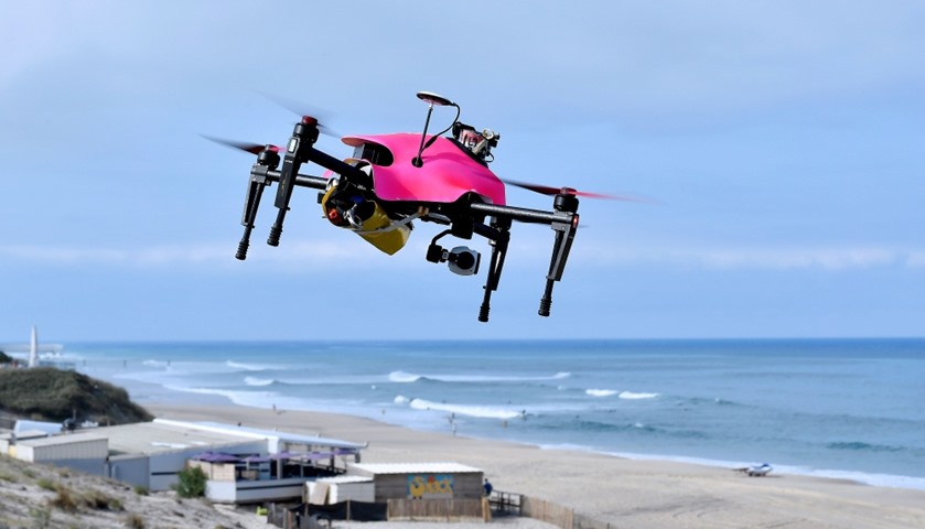 Helper, the surveillance drone  flying with a life buoy