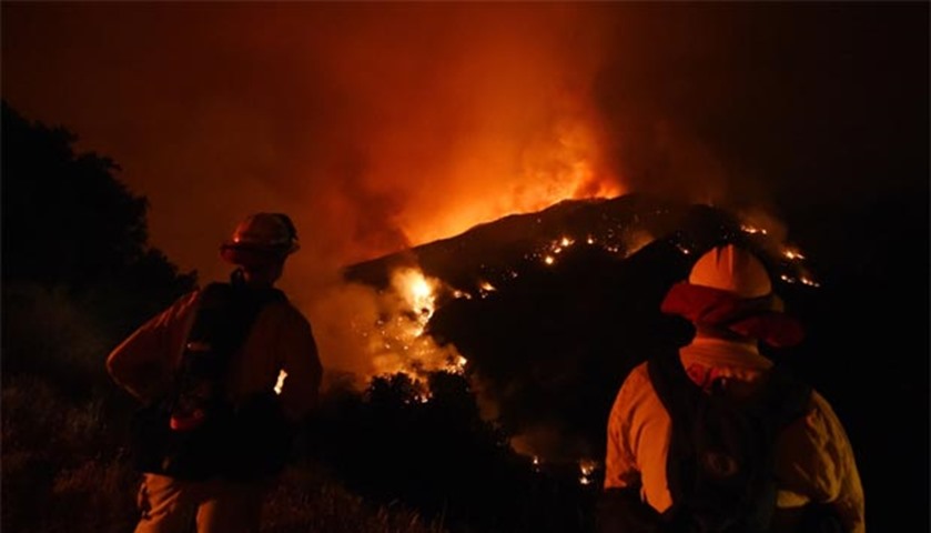Firefighters watch over the Sand Fire as it moves towards Fair Oaks Canyon in Santa Clarita
