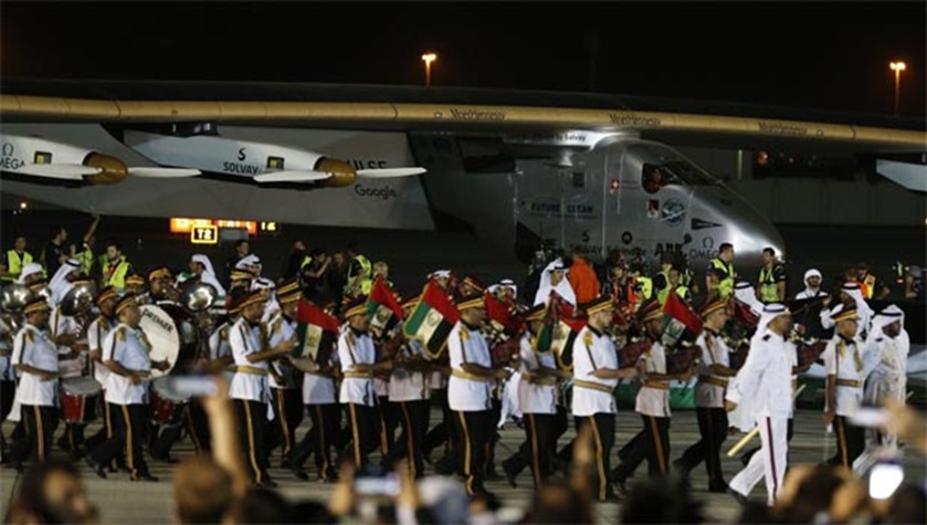 A band performs to mark the completion of the solar aircraft\'s round-the-world trip