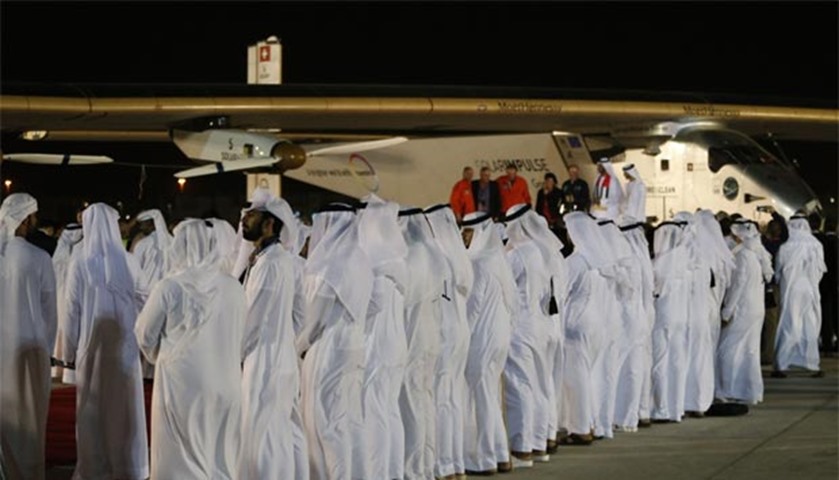 Solar Impulse 2 and its crew are greeted upon arrival by officials at Al Batin Airport in Abu Dhabi