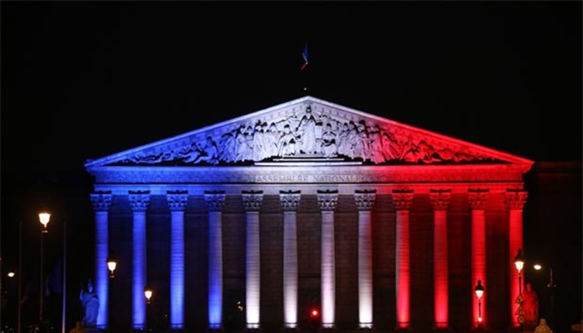 Palais Bourbon in Paris is illuminated in the French colours in tribute to the victims of the attack