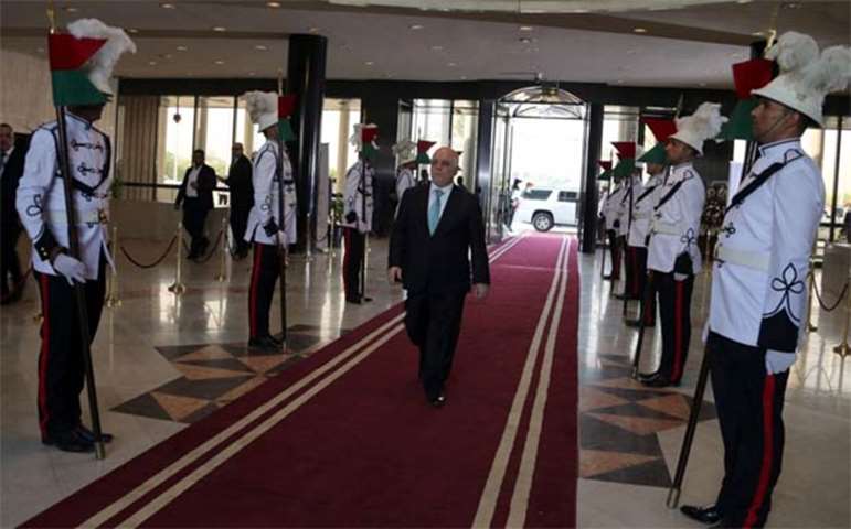 Prime Minister Haider al-Abadi arrives to attend the celebration marking victory over IS
