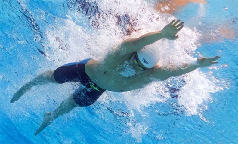 China\'s Yan Zibei competing in a men\'s 100m breaststroke heat