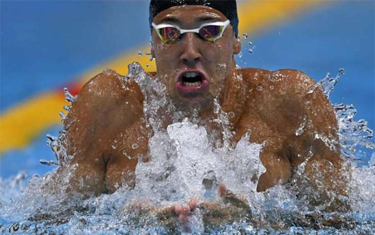 Turkey\'s Huseyin Emre Sakci during men\'s 100m breaststroke heat