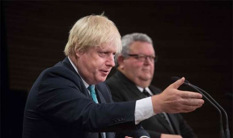Boris Johnson speaks to the media during a press conference in Wellington