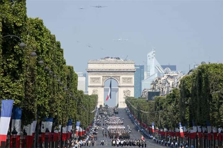 Military planes and regiments take part in the Bastille Day military parade on Champs-Elysees