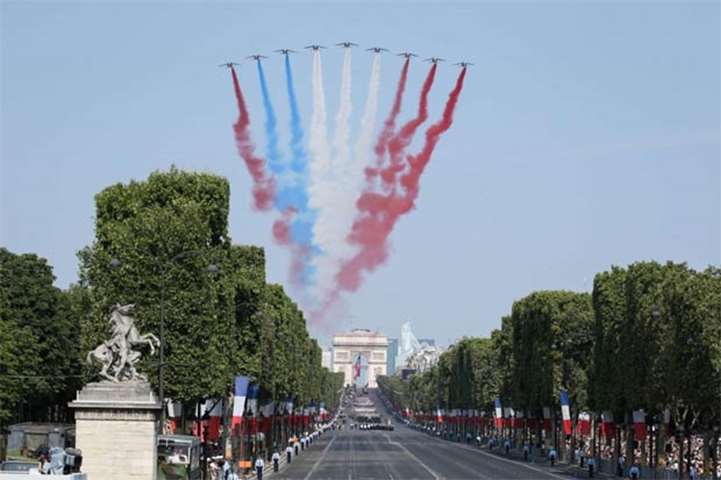 The Patrouille de France alphajets perform at the start of the military parade in Paris