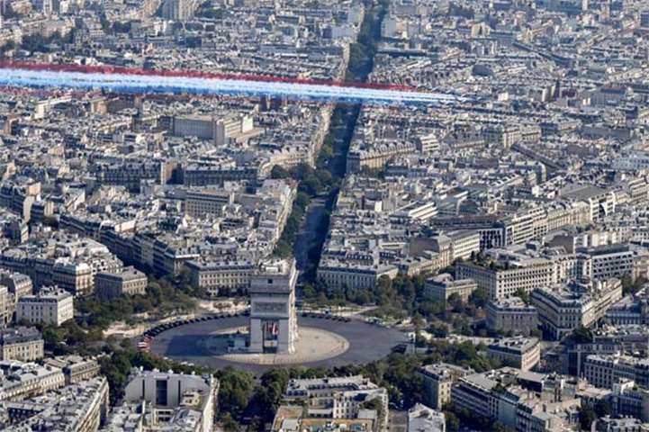 The Patrouille de France alphajets fly over the Arc de Triomphe on Saturday