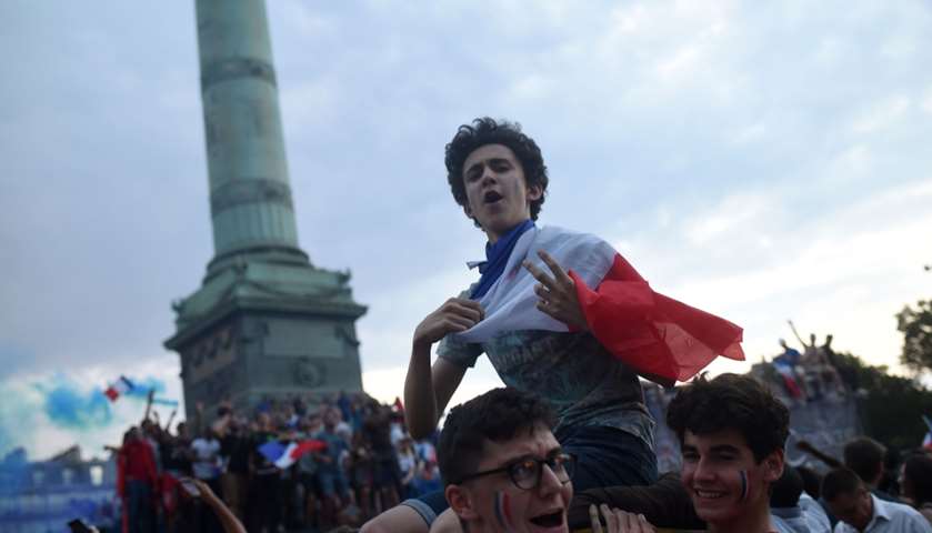 People celebrate on the Place de la Republique.