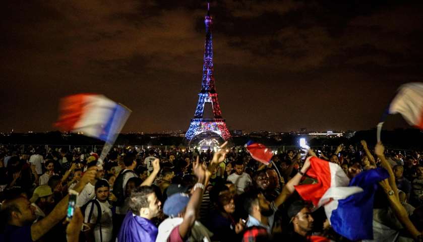 The Eiffel Tower illuminated in French national colors during celebrations