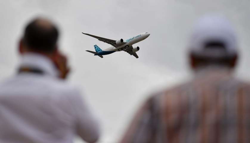 Visitors watch as an AirBus A330-900 Neo takes to the skies
