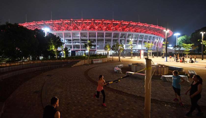 People exercising in front of the Senayan sports complex in Jakarta