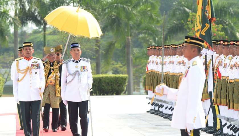 Malaysia\'s new King Al-Sultan Abdullah inspects an honour guard during his coronation