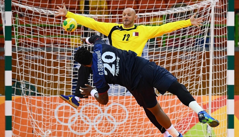 France\'s pivot Cedric Sorhaindo scores past Qatar\'s goalkeeper Danijel Saric 
