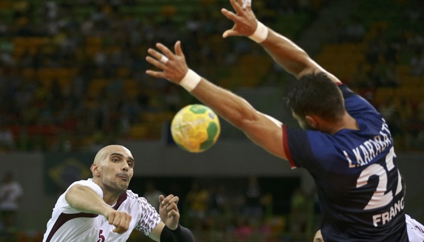 Marko Bagaric  of Qatar and Luka Karabatic  of France in action.
