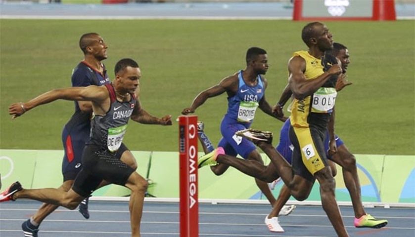 Usain Bolt of Jamaica crosses the finish line in the men\'s 100m final