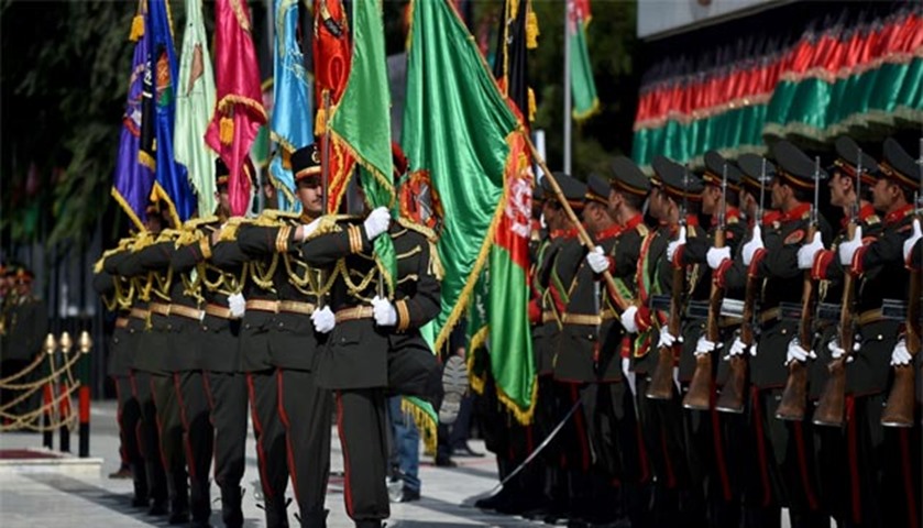 An Afghan guard of honour marches as the national anthem plays during the celebrations
