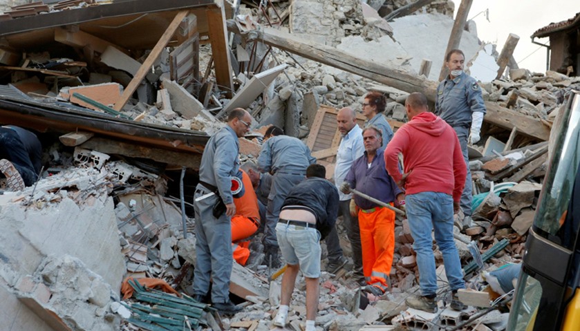 Rescuers works after a quake hit Amatrice, central Italy