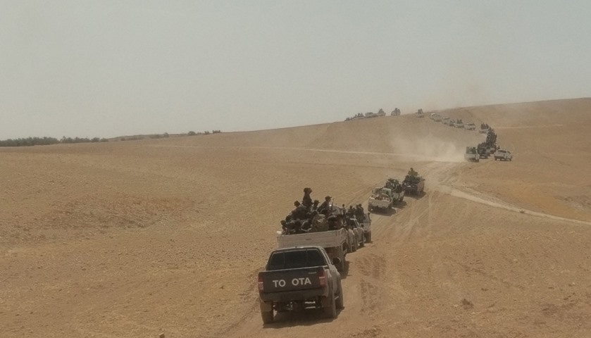 Free Syrian Army fighters on pick-up trucks and military vehicles head towards Jarablus, Syria