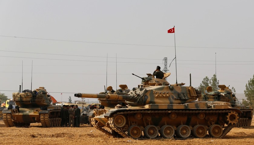 Turkish army tanks and military personal are stationed in Karkamis on the Turkish-Syrian border